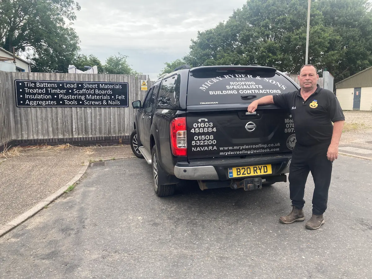 M Ryder Roofing team member with company van